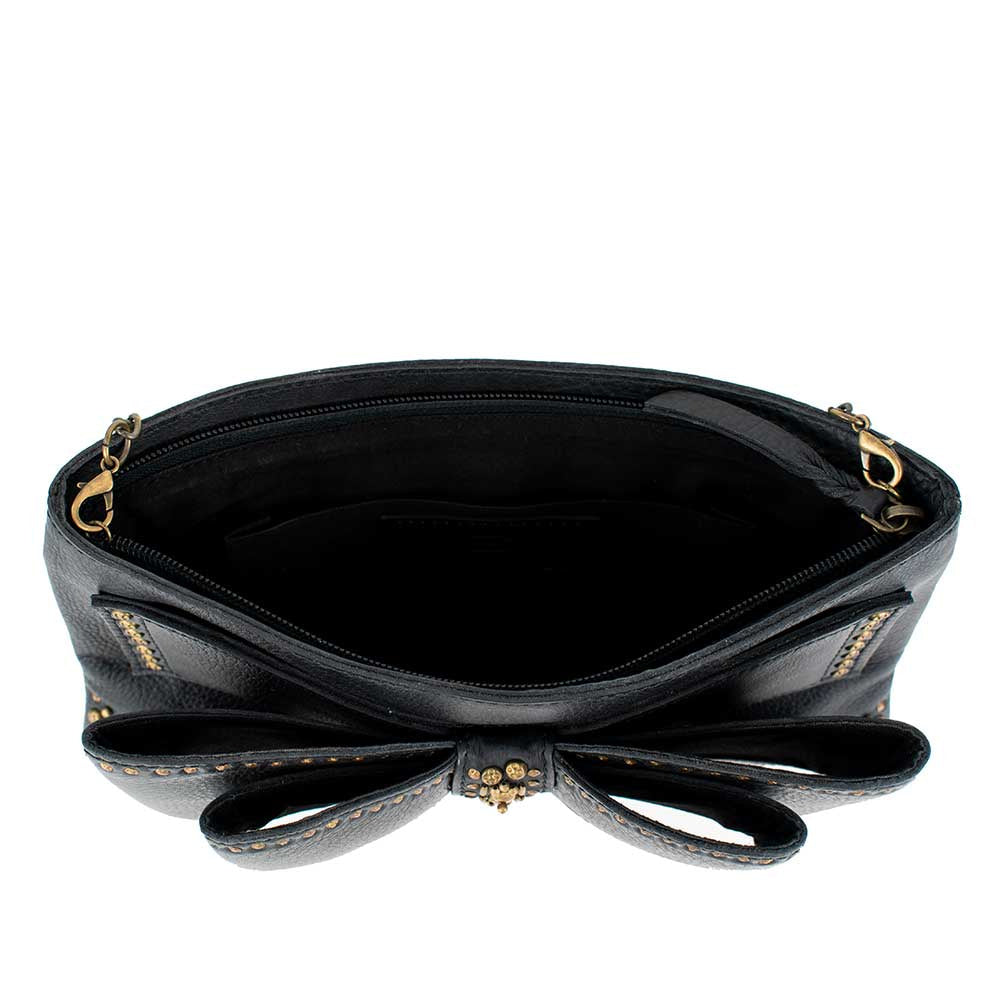 Black leather handbag with a decorative bow on the front.