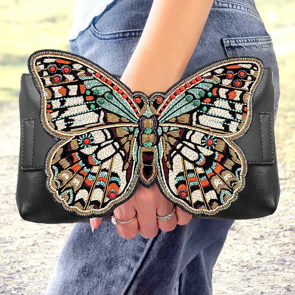 Model holding Butterfly Effect Handbag