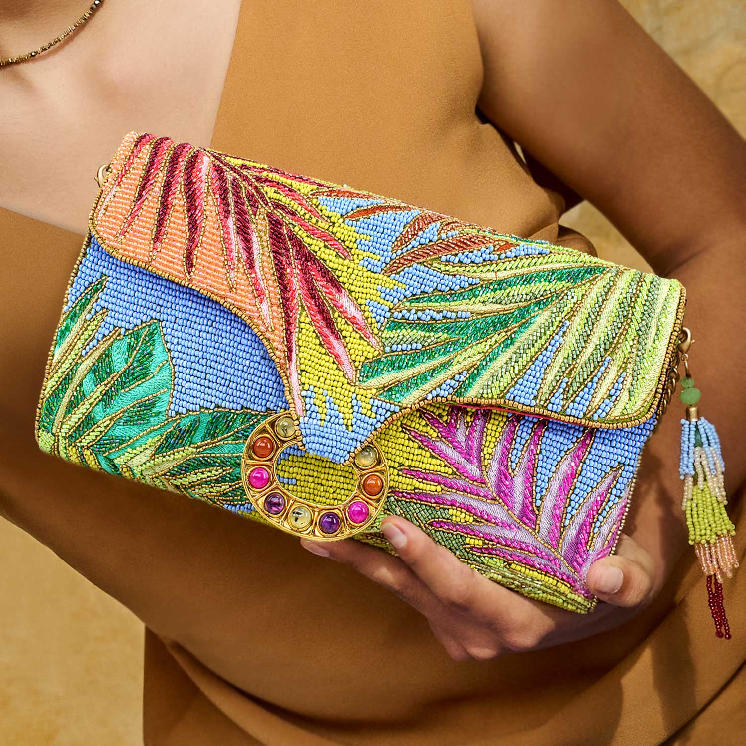 Model holding Tropics Beaded Colorful Leaves Crossbody Clutch Handbag Purse