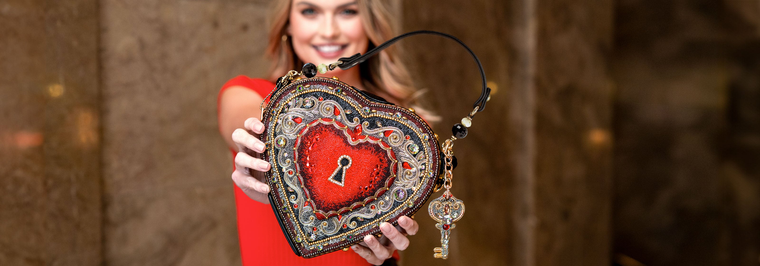 Embrace Heart Locket Top Handle Handbag