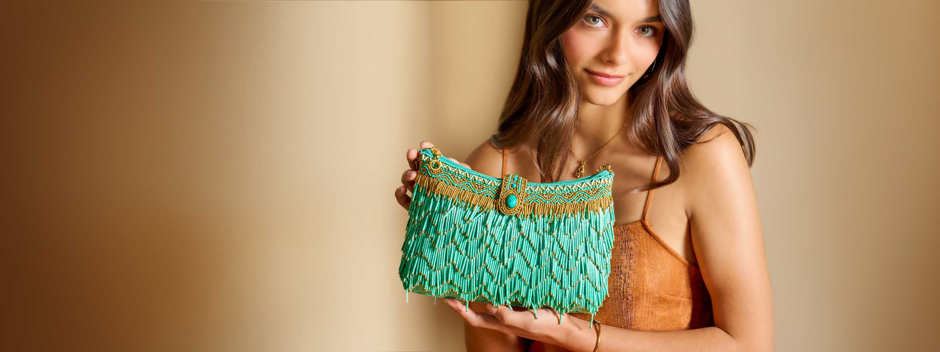 Model holding Shimmy Beaded Western Fringe Crossbody Clutch Handbag Purse